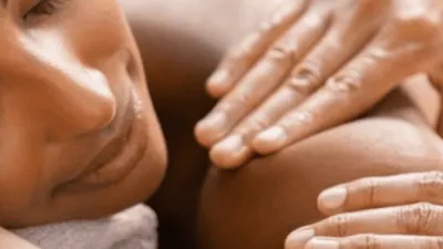 Therapist using healing massage techniques to relieve pain naturally.
