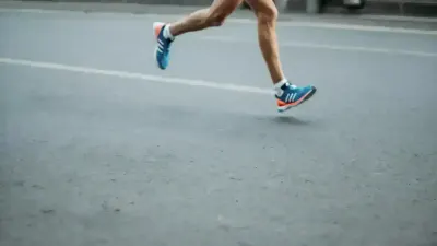 Runner training outdoors while preparing for a long-distance challenge.