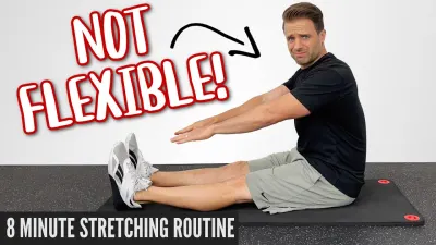 Man performing stretching exercise on mat, promoting flexibility and relaxation in Glasgow.